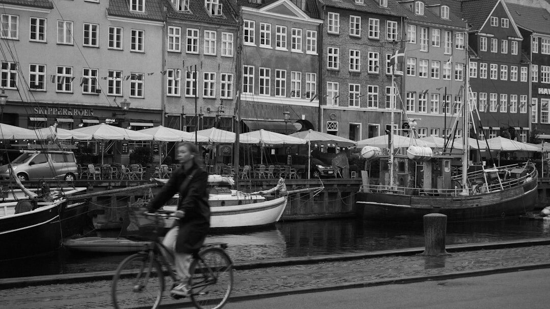 Danish dock worker in a knit sweater by the canal in Nyhavn