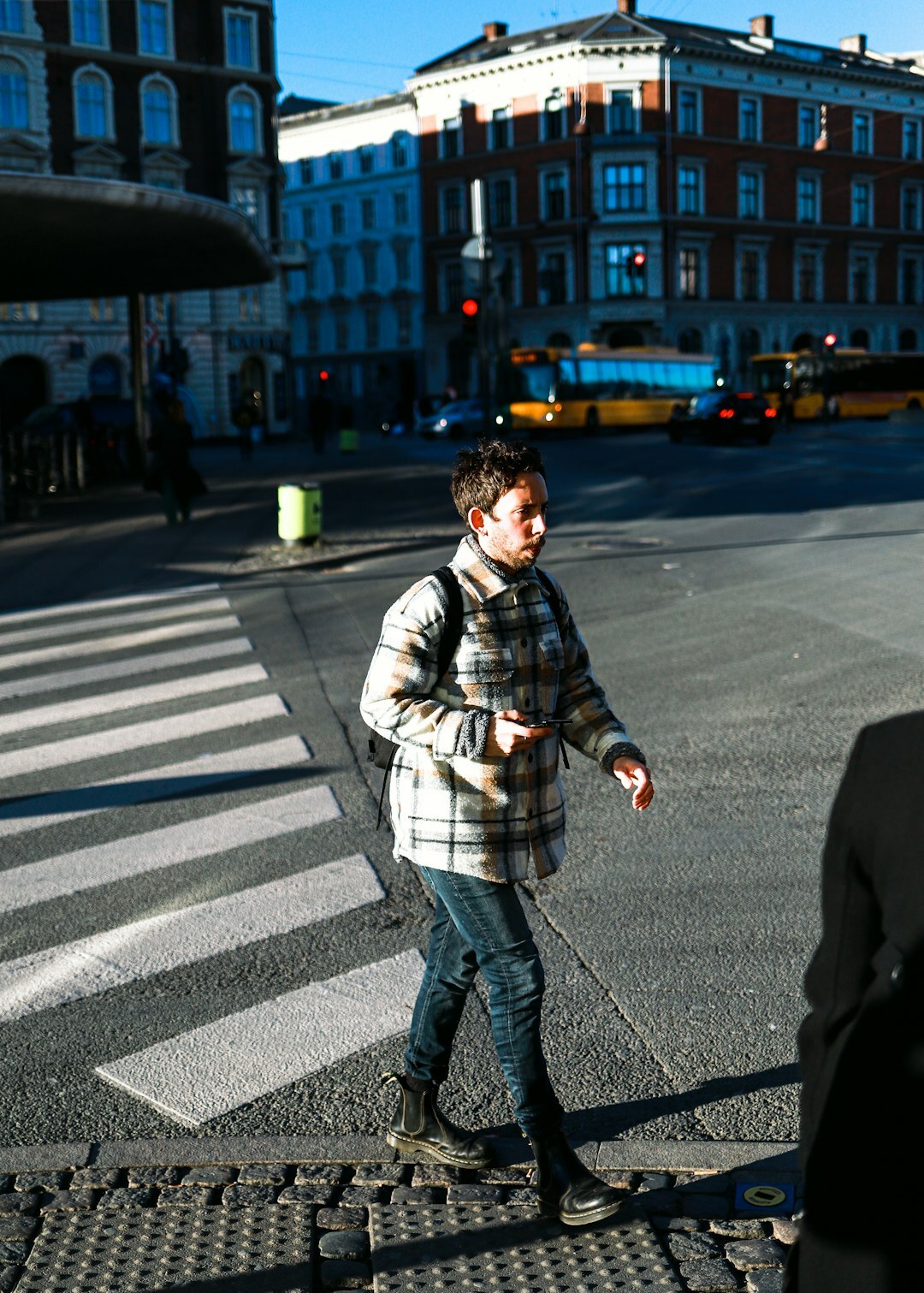 Danish journalist Lars wearing glasses and a flannel shirt